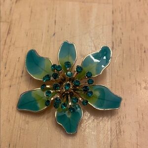 Floral Brooch with Green and Gold Accents and green crystals. About 1 3/4 x1 1/2